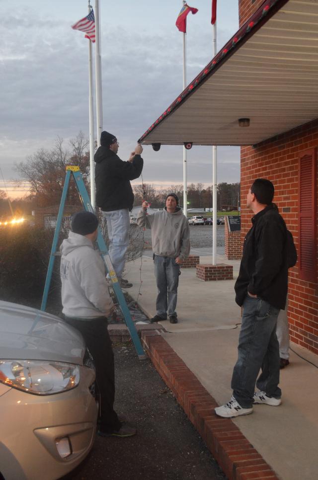 Guys setting up Christmas Decorations 2013